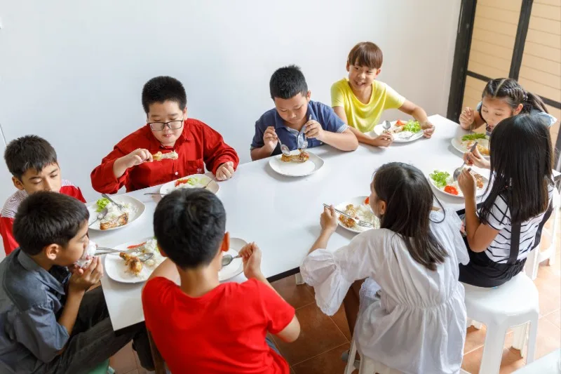 Group of children eating at a table