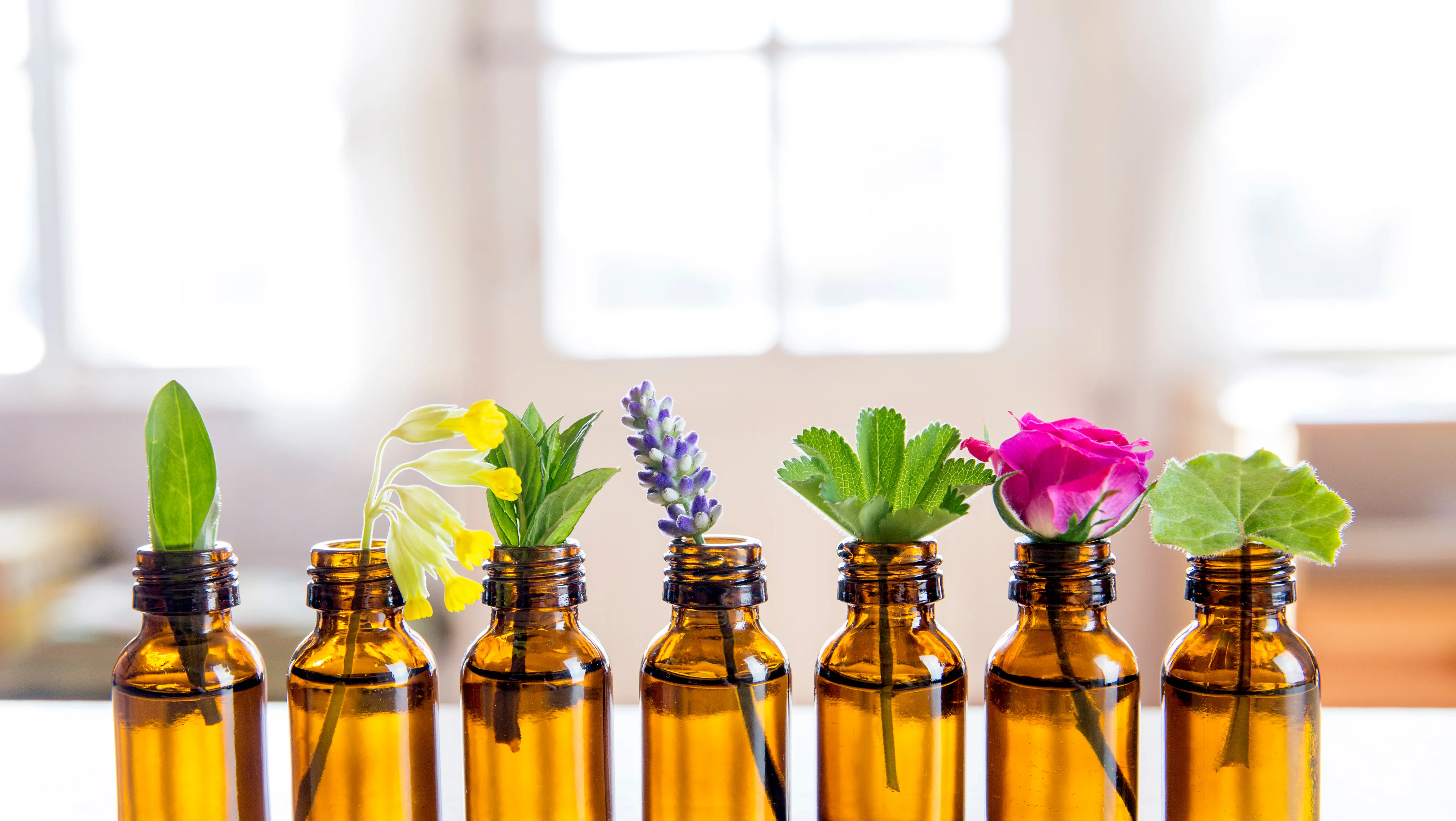 Amber glass bottles with plant sprigs
