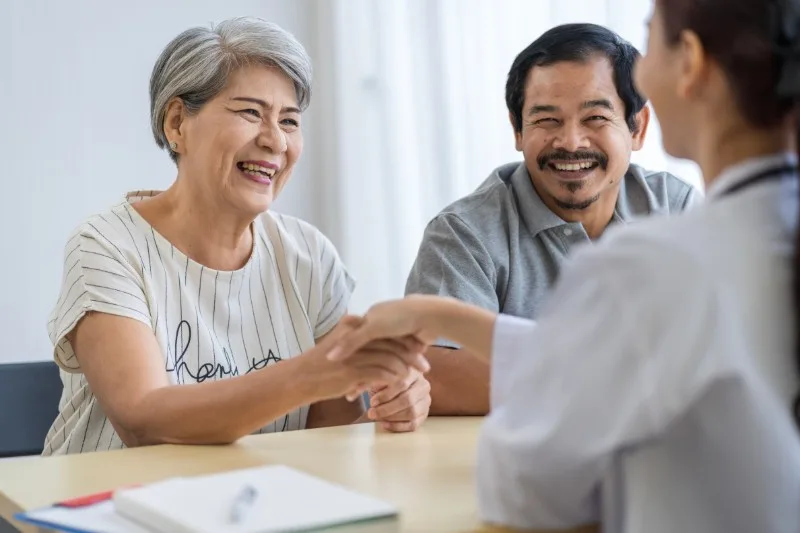 Elderly couple meeting with healthcare professional