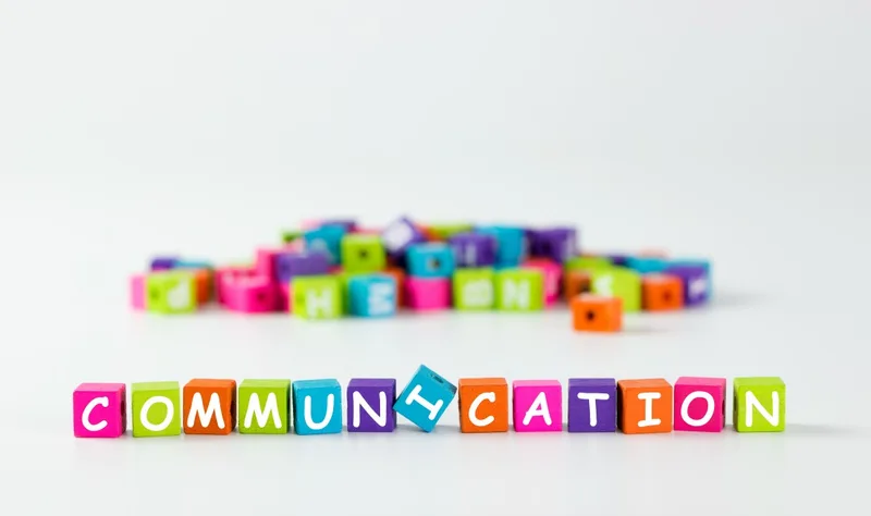 Colorful letter blocks spelling communication