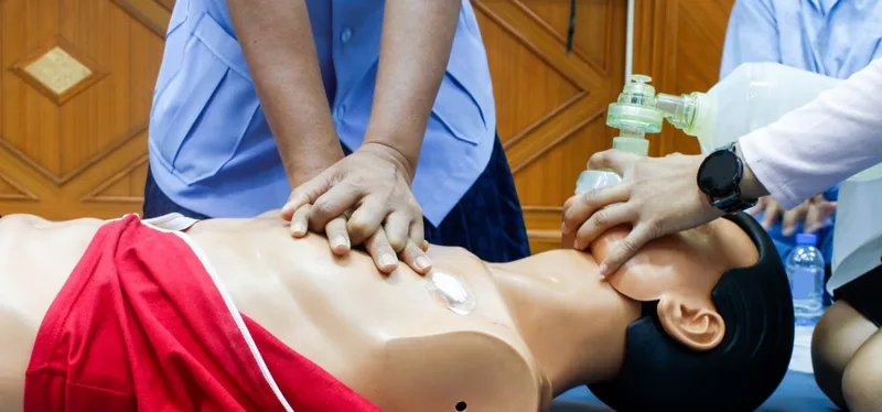 CPR training on adult manikin with rescue breaths