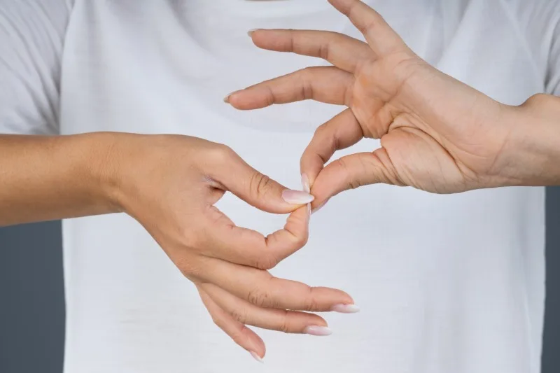 Hands forming sign language gesture