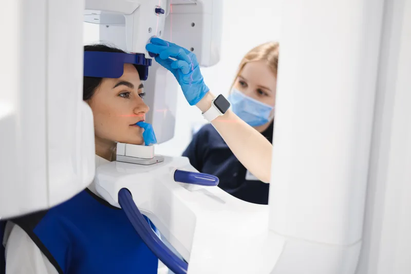Dental patient undergoing panoramic x-ray scan