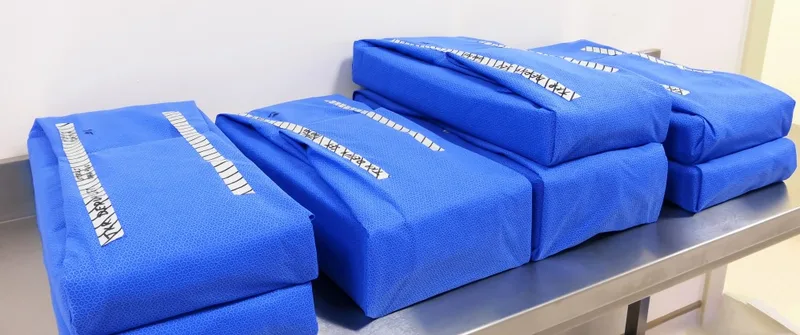 Blue wrapped sterile surgical instrument packs