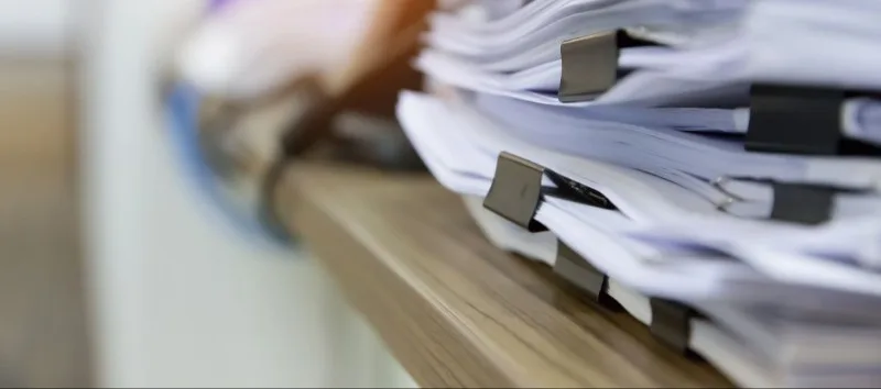 Stack of clipped paper document piles