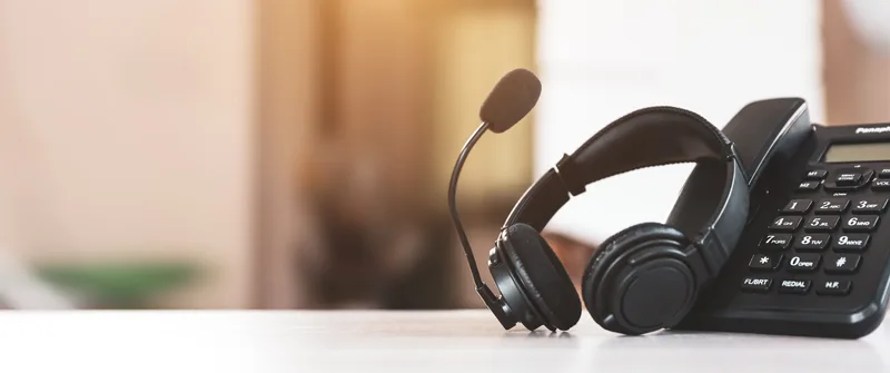 Headset and telephone for communication support