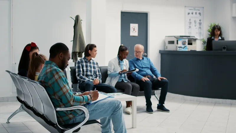 Diverse group of patients sitting in a waiting room