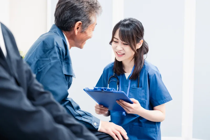 Medical staff taking a questionnaire at hospital reception