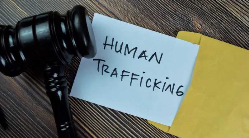 Gavel and note reading Human Trafficking