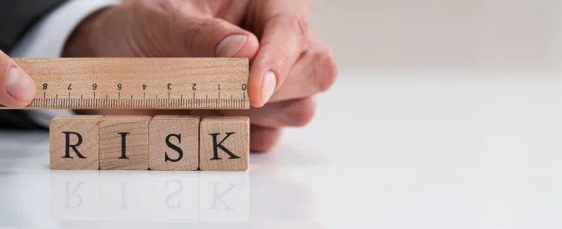 Wooden blocks spelling risk with ruler