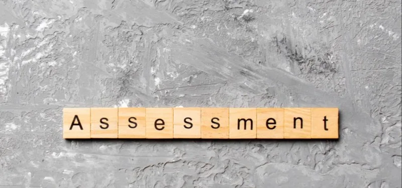 Wooden letter tiles spelling Assessment