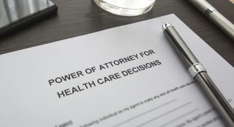 Power of Attorney for Health Care document with pen