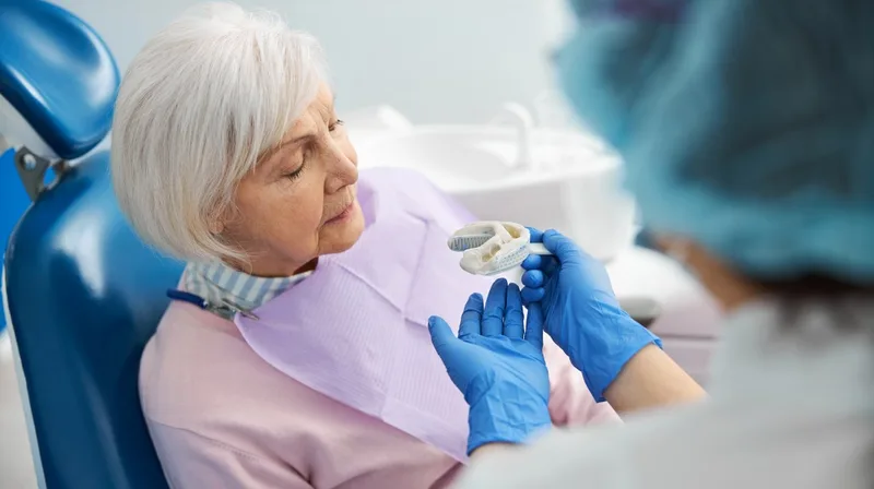 Elderly woman sitting in dental chair