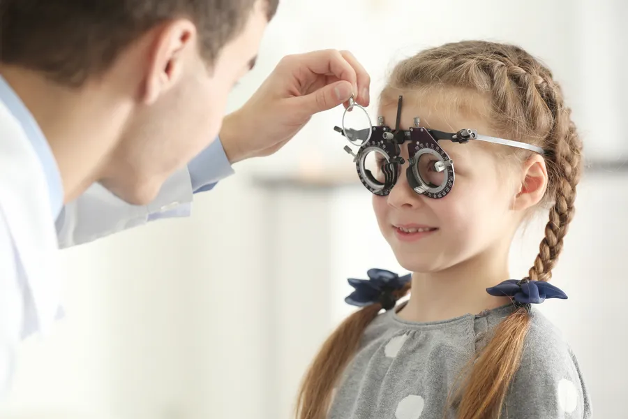 Child wearing trial frame during eye test