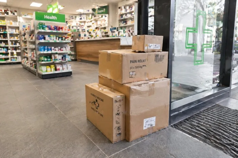 Boxes stacked near a pharmacy doorway
