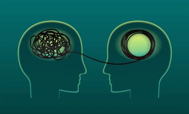 Two outlined heads connected by a thread